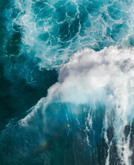 Aerial view of ocean waves breaking