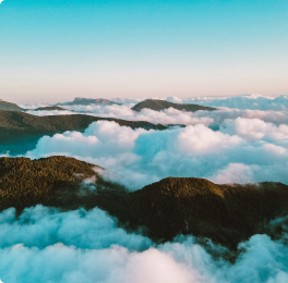 Sea of clouds over hills at sunrise
