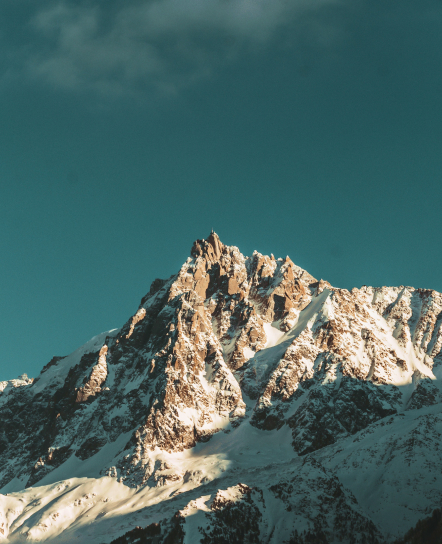 Mountain peak rising above the clouds