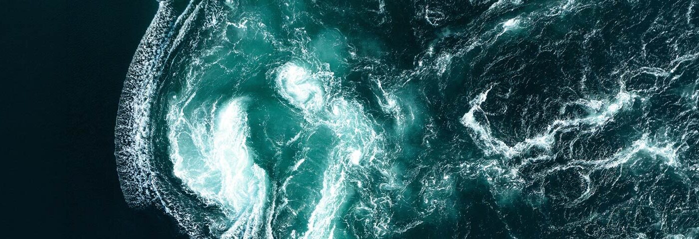 Aerial view of deep teal ocean waves
